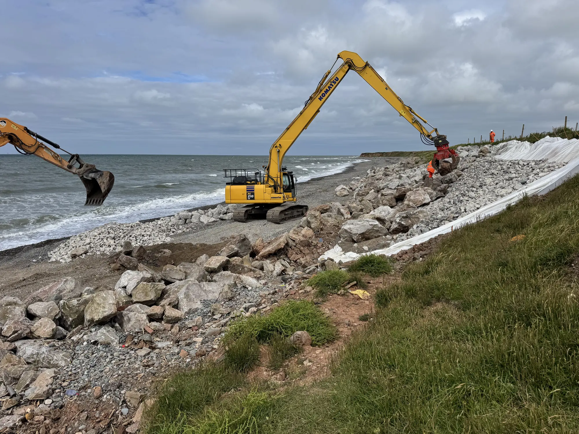 Excavators placing rock armour along the exposed South Walney shoreline